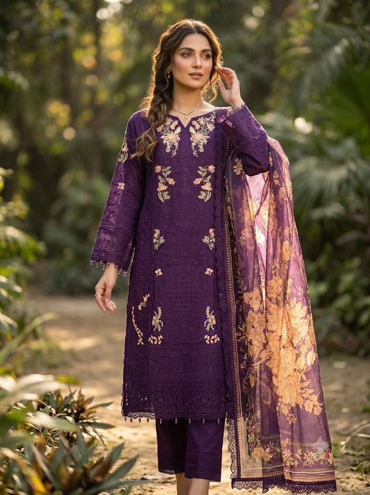 Woman wearing a purple embroidered outfit with a matching dupatta in a natural setting